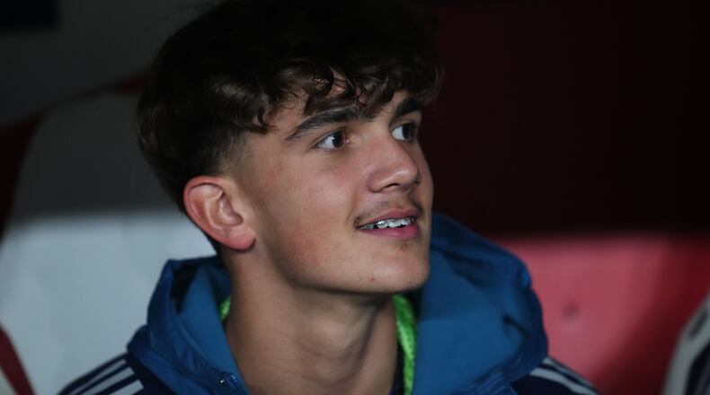 Arsenal's Max Dowman sits on the bench prior to the Champions League opening phase soccer match between Slavia Prague and Arsenal in Prague, Czech Republic, Tuesday, Nov. 4, 2025. (AP Photo/Petr David Josek)