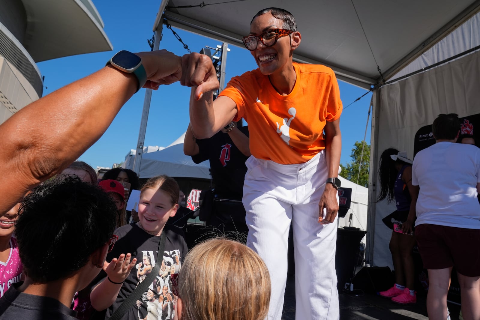 Former WNBA player Olympia Scott greets fans during a launch event announcing Portland Fire as the name of Portland's WNBA basketball franchise at the Moda Center on Tuesday, July 15, 2025, in Portland, Ore. (AP Photo/Jenny Kane)
