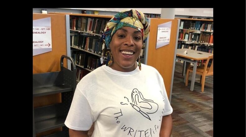 Dayton area resident shared stories of survival as part of the Dayton Strong Storytelling Sessions recorded at the Dayton Metro Library. Latesa Williamson, the Dayton poet and performer known as A Slate, of The WRITElife Village is pictures. She holds a book of poems written by children following the tornadoes.