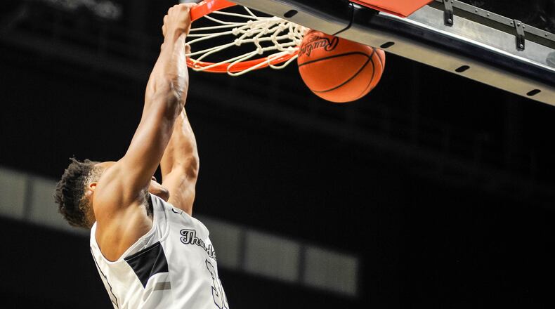 Lakota East's Nate Johnson slam dunks the ball during a Division I District final against Beavercreek on Sunday, March 8, 2020 at Xavier University's Cintas Center. East opened the season Friday with a win at Hamilton. .NICK GRAHAM / STAFF