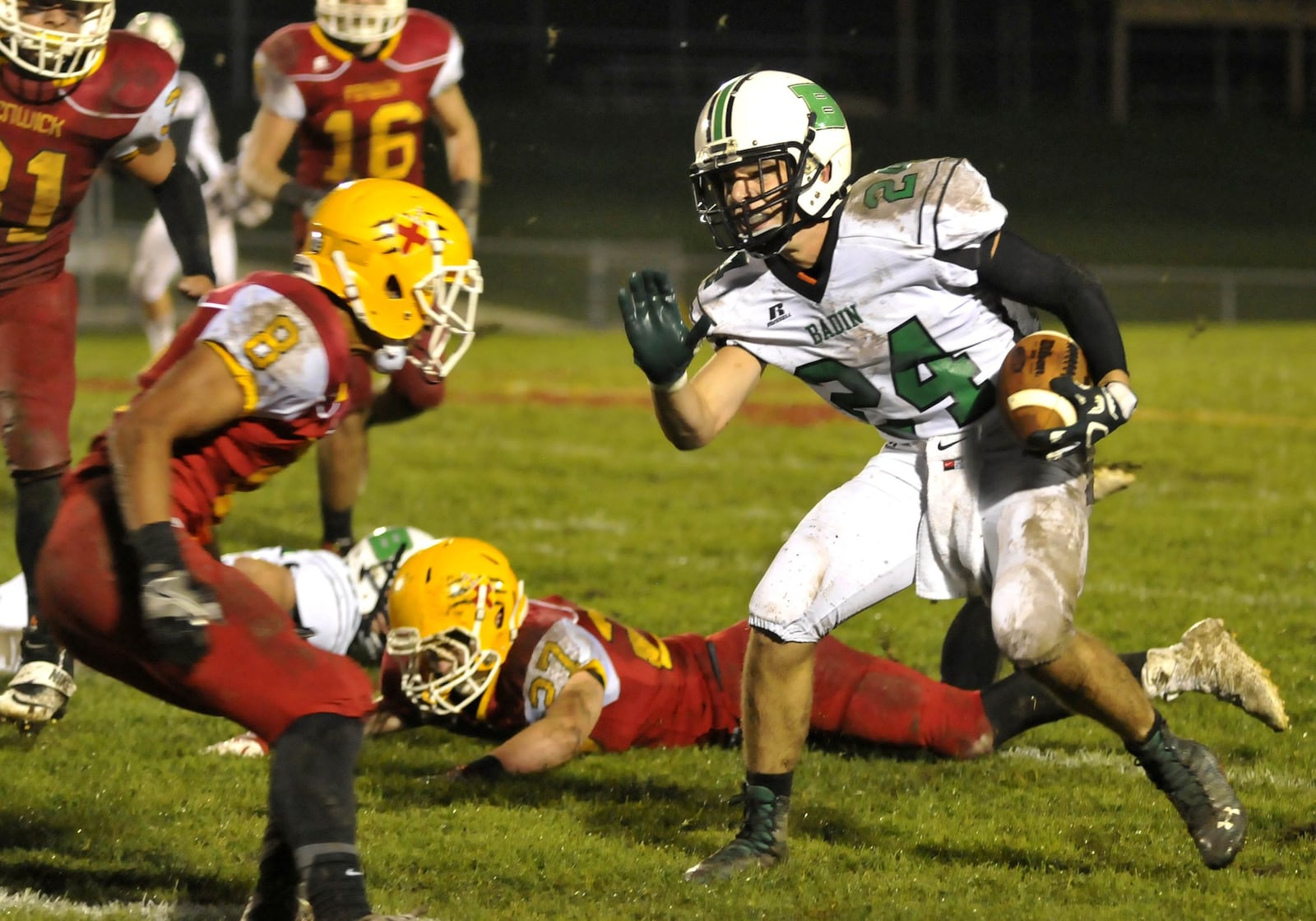 Badin’s Evan Grawe (24) attempts to evade Fenwick’s Giovanni DiGirolamo (8) during a Greater Catholic League Coed Division game Sept. 30, 2016 at Krusling Field in Middletown. The Falcons won 27-9. CONTRIBUTED PHOTO BY DAVID A. MOODIE