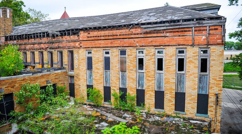 Dan Mayzum, a historic preservation architect, purchased the former Carnegie Library at the corner of First Avenue and Curtis Street in Middletown. Mayzum wants to turn the building into a home brewers brewery, a restaurant, a reception and banquet room and a cooperative workspace and marketing research facility. He said the project needs $1.3 million in Historic Tax Credits. NICK GRAHAM/STAFF