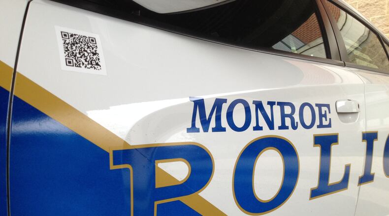 Police are looking for suspects who took guns from a Monroe residence and then fled from officers.