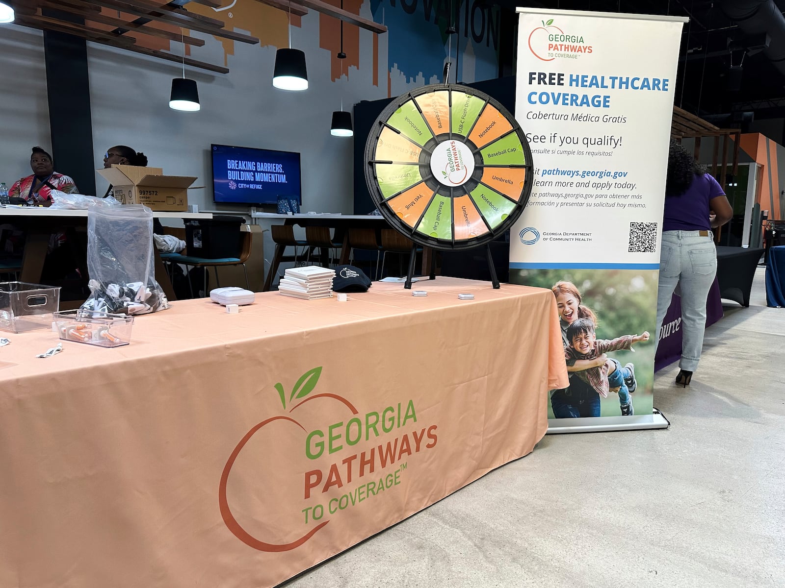 A stand for Georgia Pathways is seen at a job fair in Atlanta, Ga. Thursday, June 5, 2025. (AP Photo/Sudhin Thanawala)
