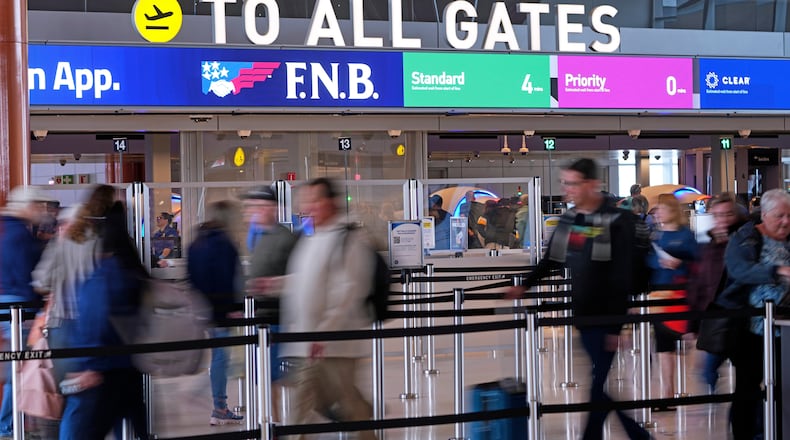 Airline travelers make their way through a TSA checkpoint queue at Pittsburgh International Airport in Imperial, Pa., Monday, March 23, 2026. (AP Photo/Gene J. Puskar)