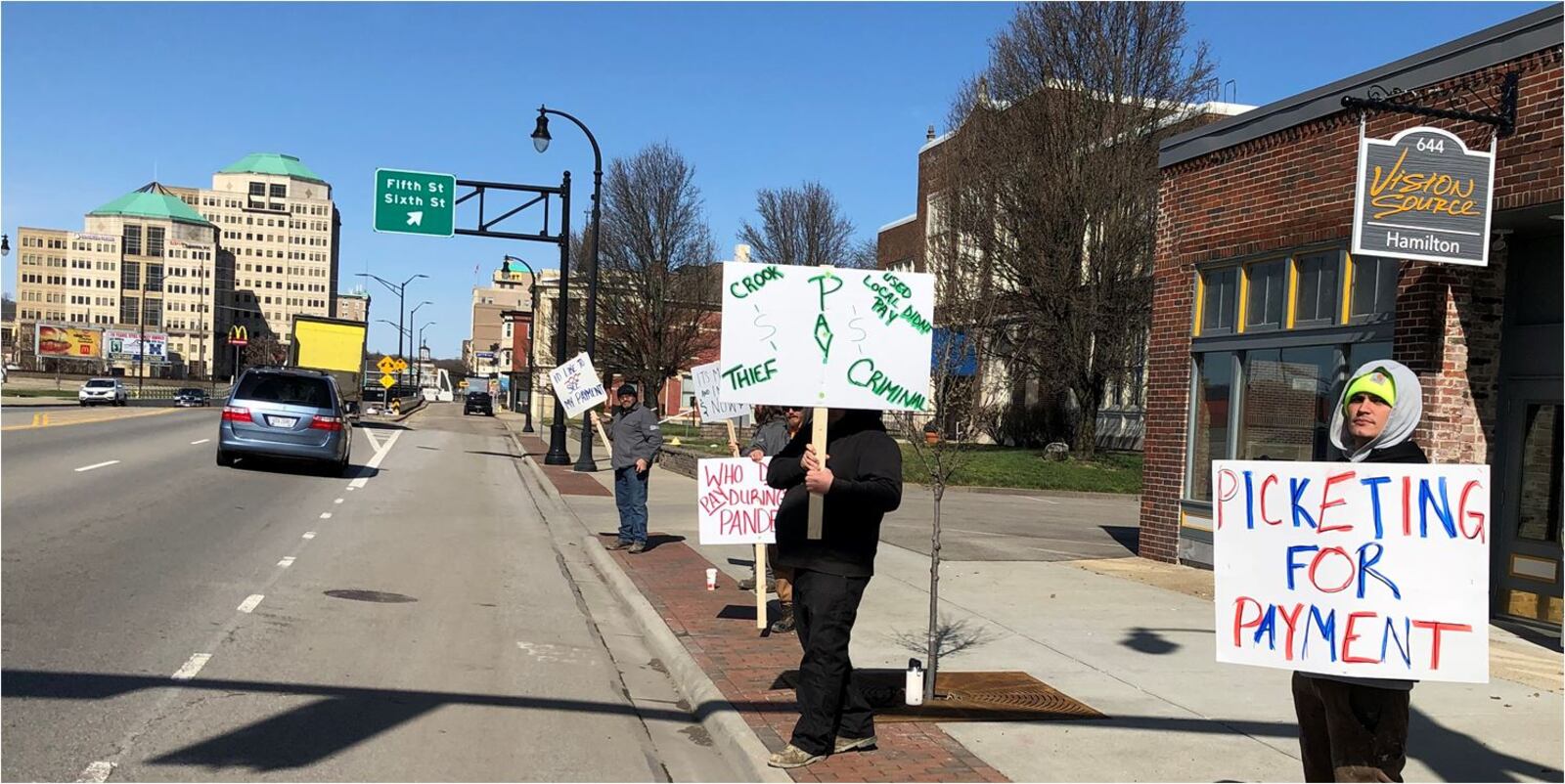Picketers have been outside Vision Source on High Street protesting that they haven't been paid what they say their company, TAMZ Construction, is due for work on the project. The owner, Dr. Tom Nye, said costs went above what he was promised they would be. MIKE RUTLEDGE/STAFF