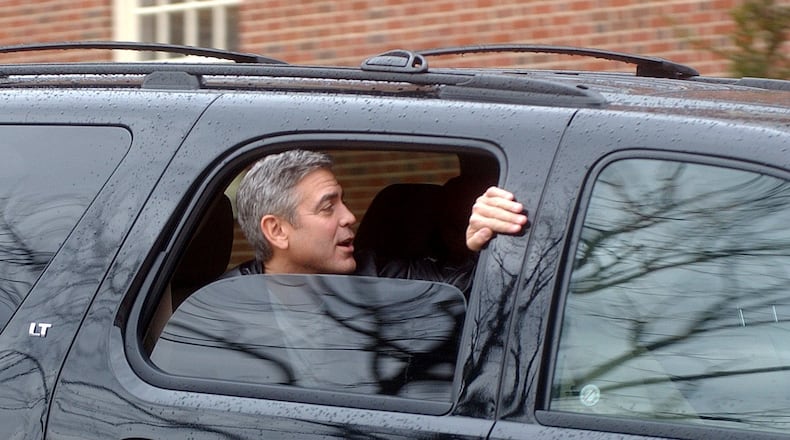 George Clooney leaves out the back of Hall Auditorium after wrapping filming in Oxford on his film "The Ides of March" Friday, March 4. Staff photo by Meagan Engle