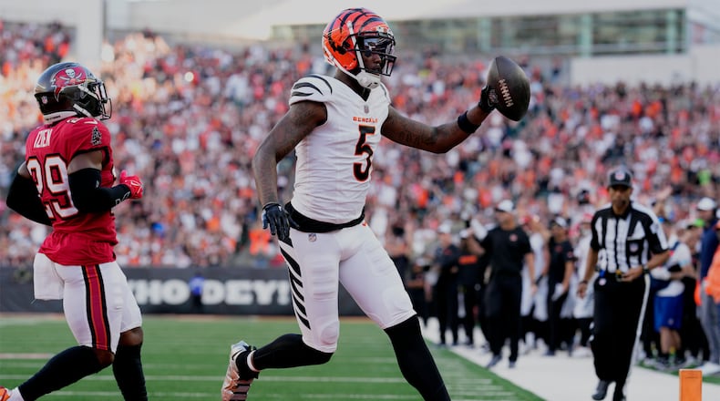 Cincinnati Bengals wide receiver Tee Higgins (5) scores a touchdown against the Tampa Bay Buccaneers in the first half of an NFL preseason football game Saturday, Aug. 10, 2024, in Cincinnati. (AP Photo/Jeff Dean)