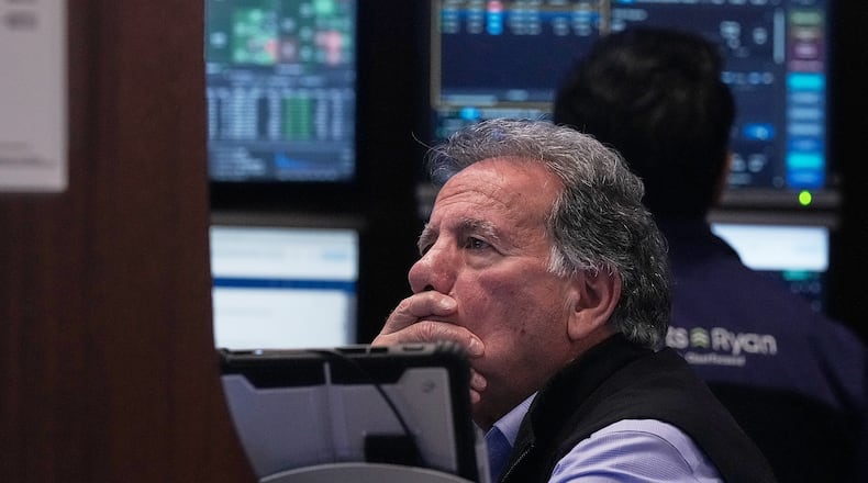 Trader Sal Suarino works on the floor of the New York Stock Exchange, Monday, Jan. 12, 2026. (AP Photo/Richard Drew)