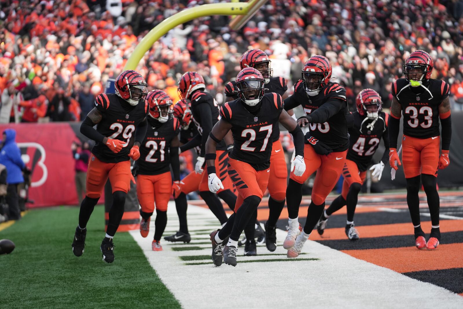 Cincinnati Bengals safety Jordan Battle (27) celebrates with teammates after intercepting the ball in the end zone during the second half of an NFL football game against the Cleveland Browns, Sunday, Dec. 22, 2024, in Cincinnati. The Bengals won 24-6. (AP Photo/Joshua A. Bickel)