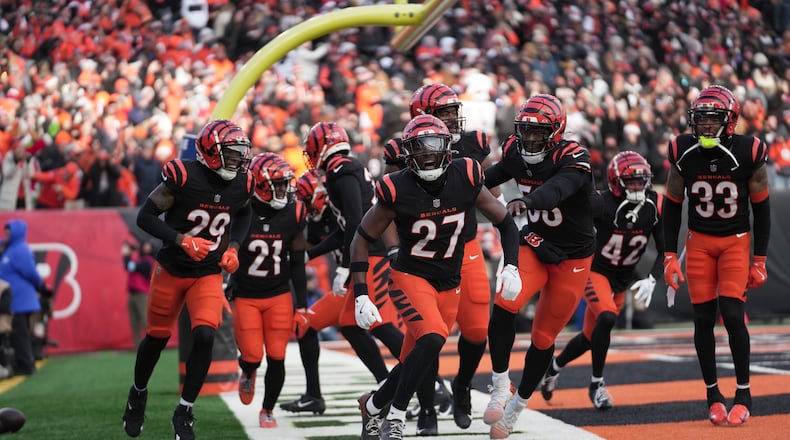 Cincinnati Bengals safety Jordan Battle (27) celebrates with teammates after intercepting the ball in the end zone during the second half of an NFL football game against the Cleveland Browns, Sunday, Dec. 22, 2024, in Cincinnati. The Bengals won 24-6. (AP Photo/Joshua A. Bickel)