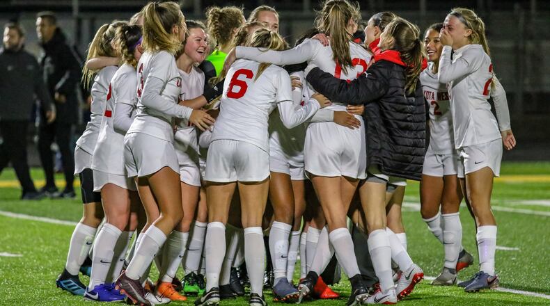 The Lakota West High School girls soccer team celebrates after beating Dublin Coffman 2-1 in a Division I state semifinal match on Tuesday night at Springfield High School. The unbeaten Firebirds (21-0-2) will play Whitehouse Anthony Wayne in the state final at 7 p.m. Saturday at MAPFRE Stadium in Columbus. CONTRIBUTED PHOTO BY MICHAEL COOPER