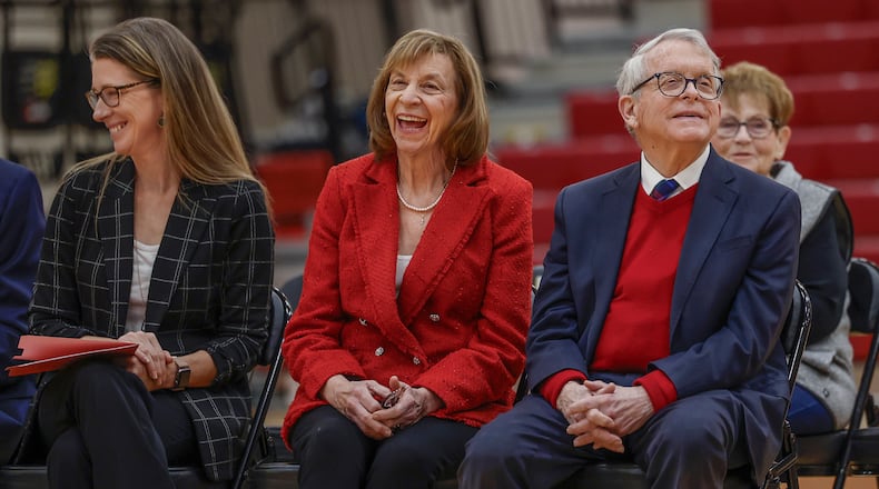 Tiffany Ways, left, chief school health officer of Health Partners of Western Ohio, First Lady Fran DeWine, center, and Ohio Gov. Mike DeWine share laughs as a speaker talks to students and teachers about the new children's eyesight program, OhioSEE, at Northeastern Elementary School on Monday, Feb. 9, 2026, in South Vienna. JOSEPH COOKE/STAFF