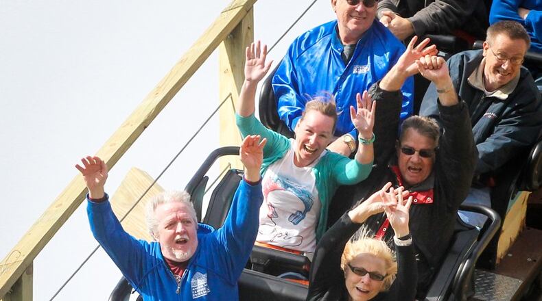 Riders enjoy the new wooden roller coaster Mystic Timbers at Kings Island on Thursday, April 13. The ride opens to the public on Saturday. GREG LYNCH / STAFF