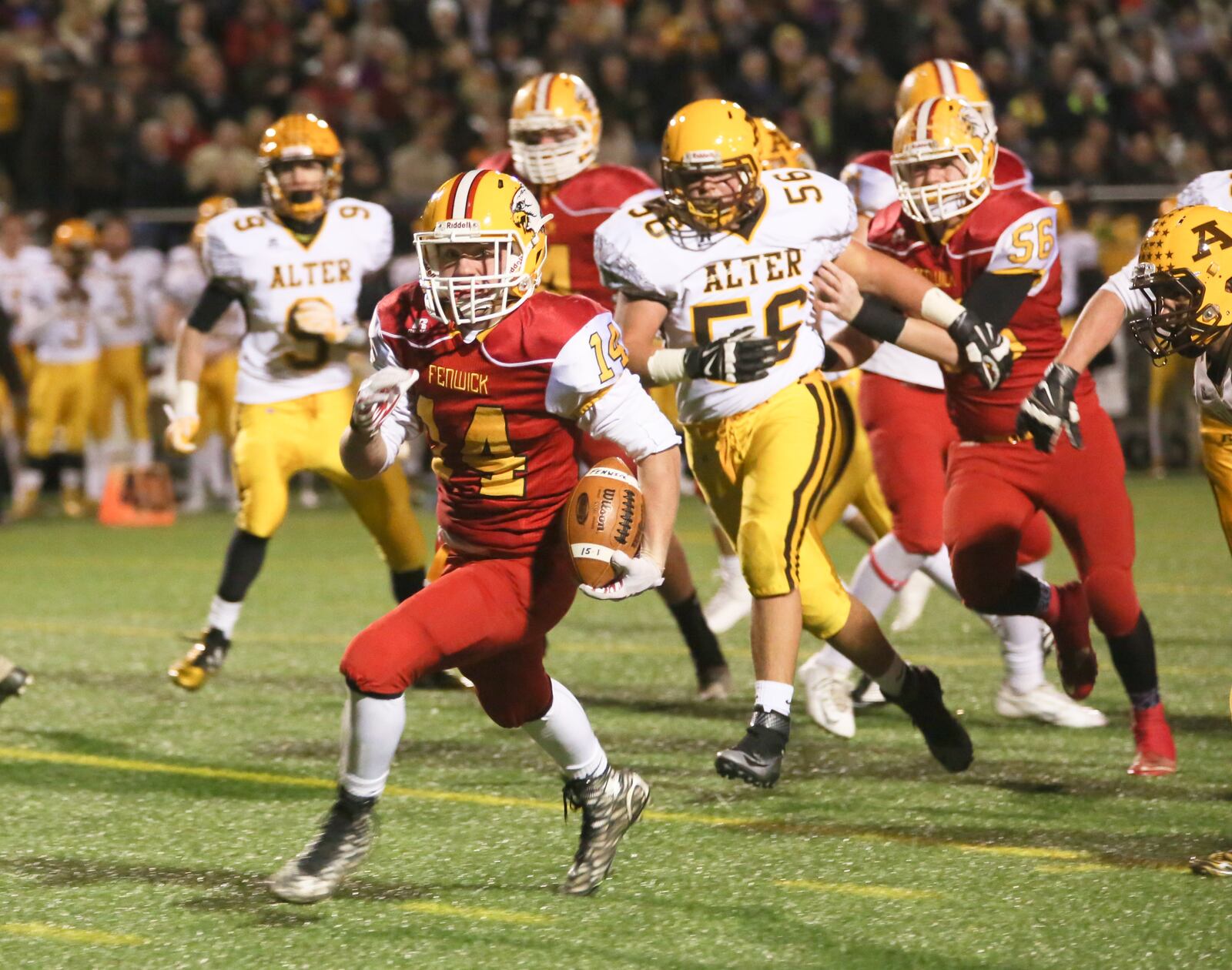 Fenwick running back Keegan Corbett (14) makes a big gain up the middle during their Division IV playoff game against Alter at Dayton Outpatient Center Stadium in West Carrollton, Saturday, Nov. 14, 2015. GREG LYNCH / STAFF