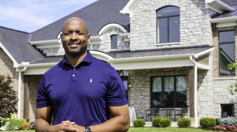 Andrew Frazier stands in front of The Stonewood at the new Highlands at Heritage Hill development in Union Twp. during Homearma, the nation’s oldest luxury home showcase, on July 19, 2018. Frazier was the first African American featured in Homearama’s 55-year history. GREG LYNCH / JOURNAL-NEWS