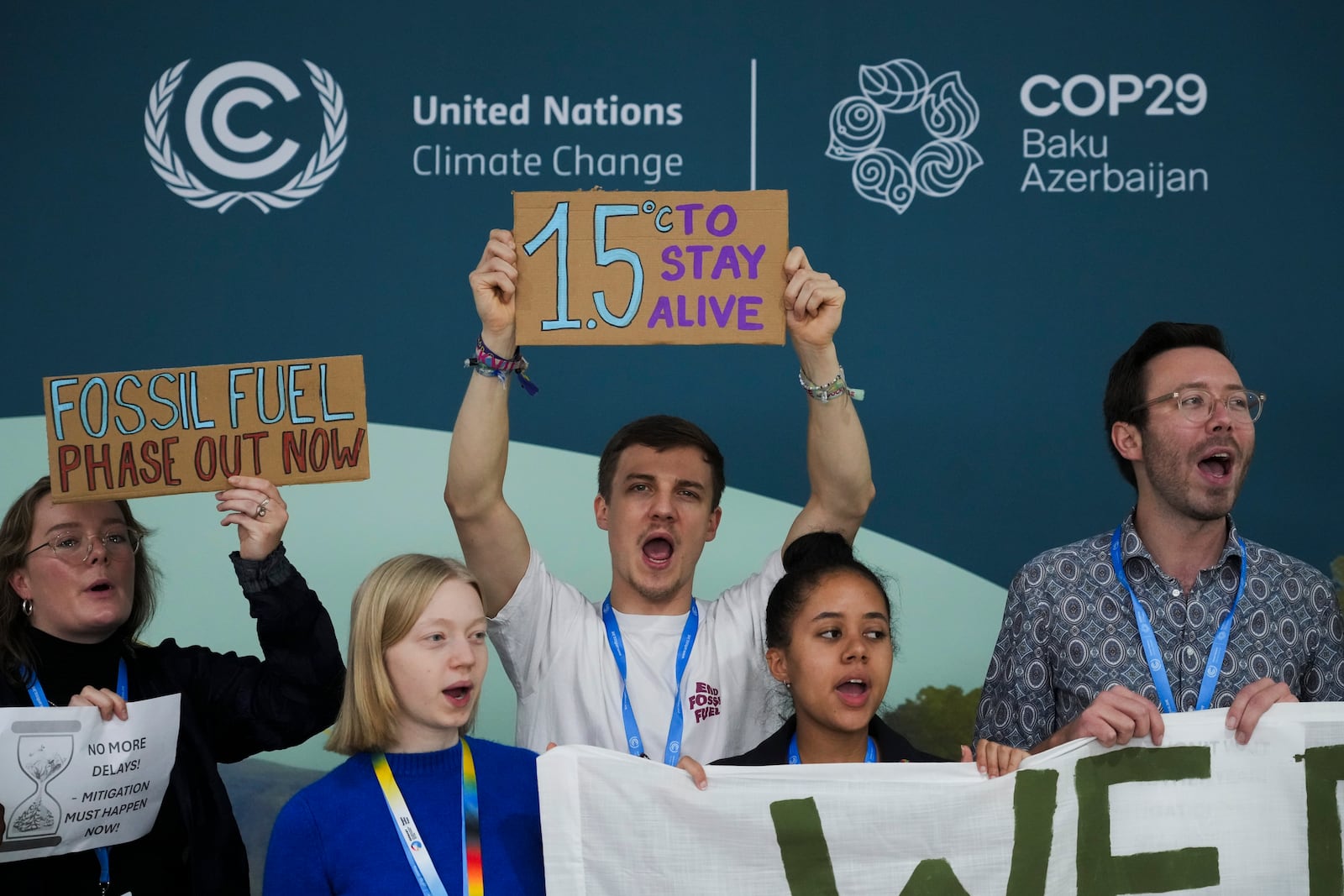 FILE - Activists participate in a demonstration for phasing out fossil fuels at the COP29 U.N. Climate Summit, Nov. 19, 2024, in Baku, Azerbaijan. (AP Photo/Sergei Grits, File)