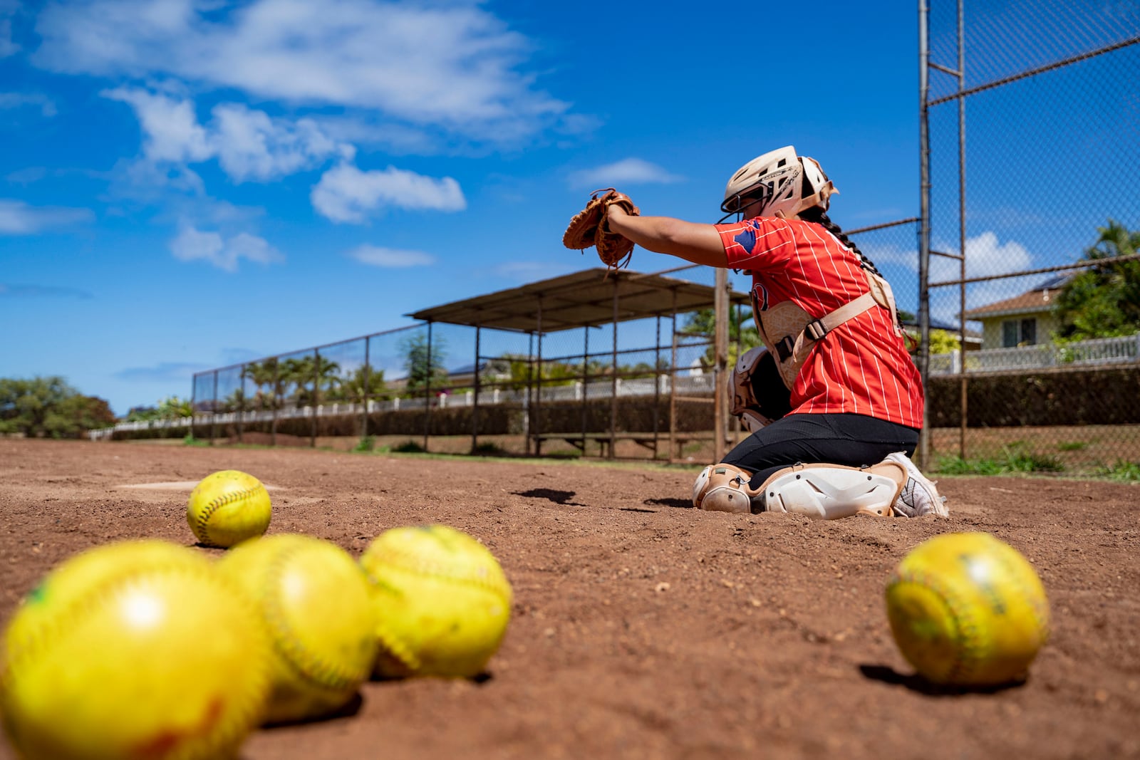 Ry-n Uyeda runs through a catching drill, Friday, July 11, 2025, in Waianae, Hawaii. (AP Photo/Mengshin Lin)