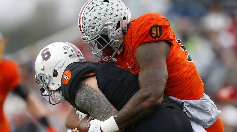 MOBILE, AL - JANUARY 27: Kurt Benkert #6 of the South team is sacked by Jalyn Holmes #91 of the North team during the first half of the Reese's Senior Bowl at Ladd-Peebles Stadium on January 27, 2018 in Mobile, Alabama. (Photo by Jonathan Bachman/Getty Images)