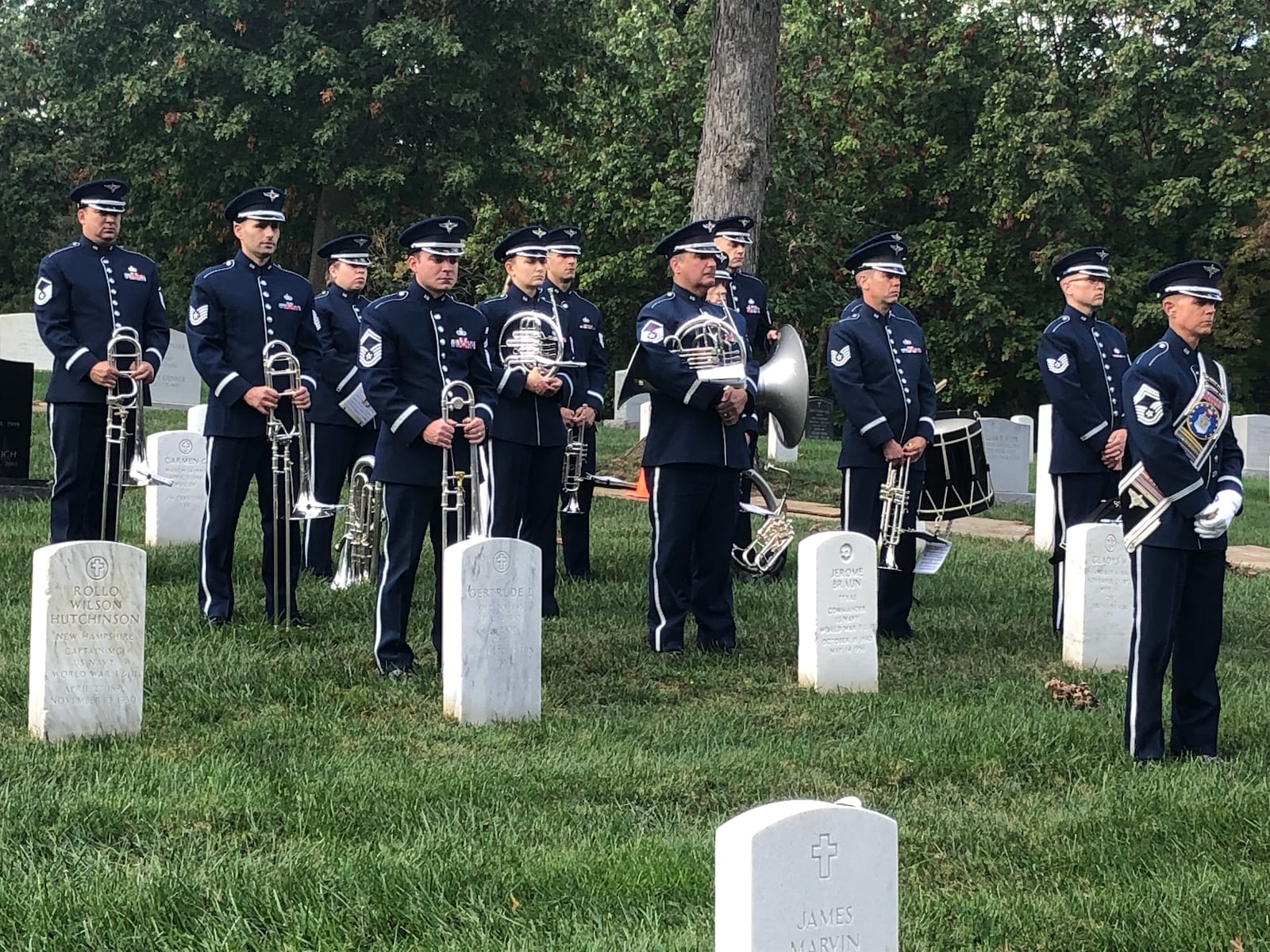 Members of the U.S. Air Force band stand at attention during the funeral for Maris McCrabb, a 25-year veteran who was buried last week at Arlington National Cemetery. RICK McCRABB/STAFF