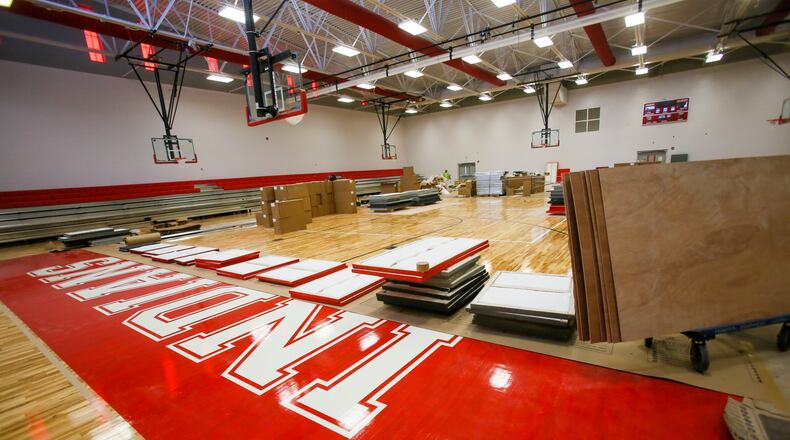 Crews work in June on the basketball court at the new Fairfield Freshman School. GREG LYNCH / STAFF