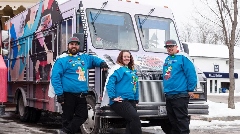 Magical Mystery Heroes, team members, Hannah Schulz, Matthew Williams, Chris Schulz, pose by their truck, as seen on The Great Food Truck Race, Season 11.