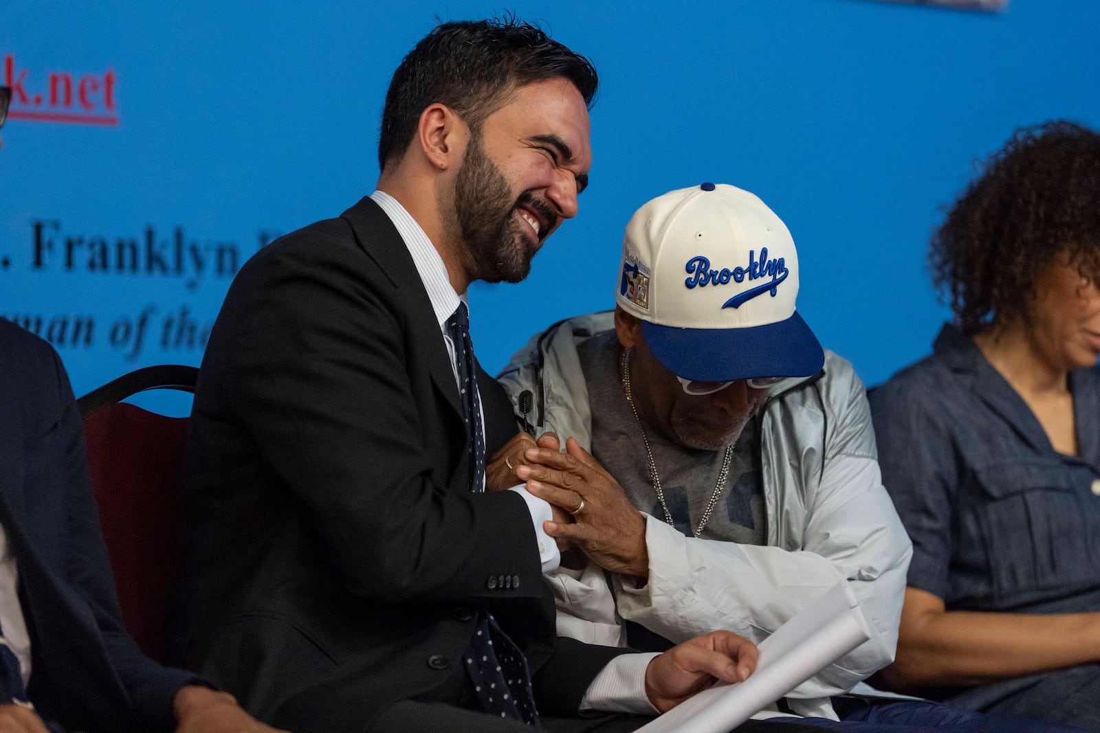 Spike Lee, right, and Democratic mayoral candidate Zohran Mamdani, left, react during the National Action Network's Saturday action rally at House of Justice in Harlem, Saturday, June 28, 2025, in New York. (AP Photo/Yuki Iwamura)