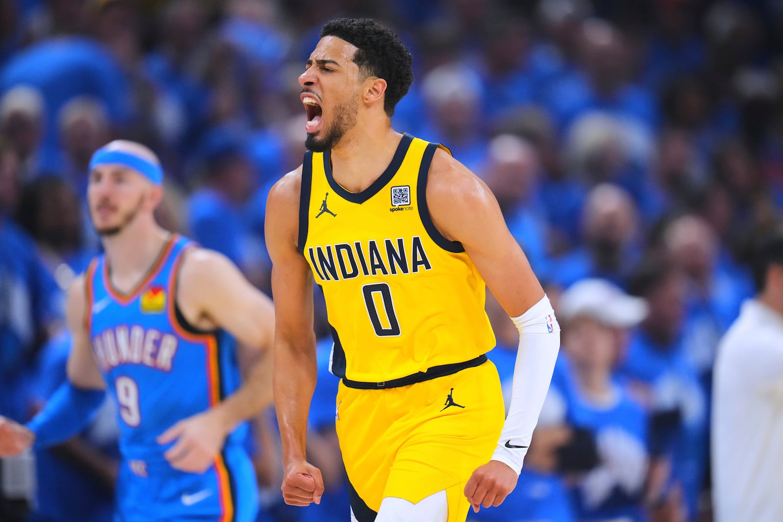 Indiana Pacers guard Tyrese Haliburton reacts after scoring during the first half of Game 7 of the NBA Finals basketball series against the Oklahoma City Thunder Sunday, June 22, 2025, in Oklahoma City. (AP Photo/Julio Cortez)