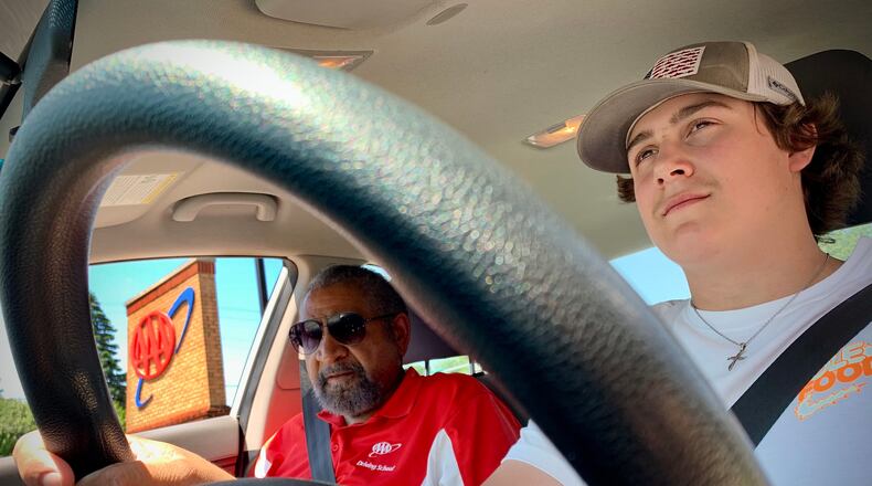 AAA driving school instructor Guy Jones, left, with student driver Zach Lehman, 16, as they head out for an on-road session Tuesday, May 31, 2022. MARSHALL GORBY\STAFF