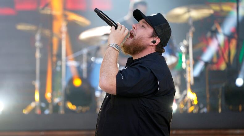 FILE - In this May 13, 2021, file photo, Luke Combs performs at the CMT Music Awards in Nashville, Tenn. Combs is paying the funeral expenses of three young men who saw him perform at a Michigan event before they died from accidental carbon monoxide poisoning at a nearby campground, relatives said. (AP Photo/Mark Humphrey, File)