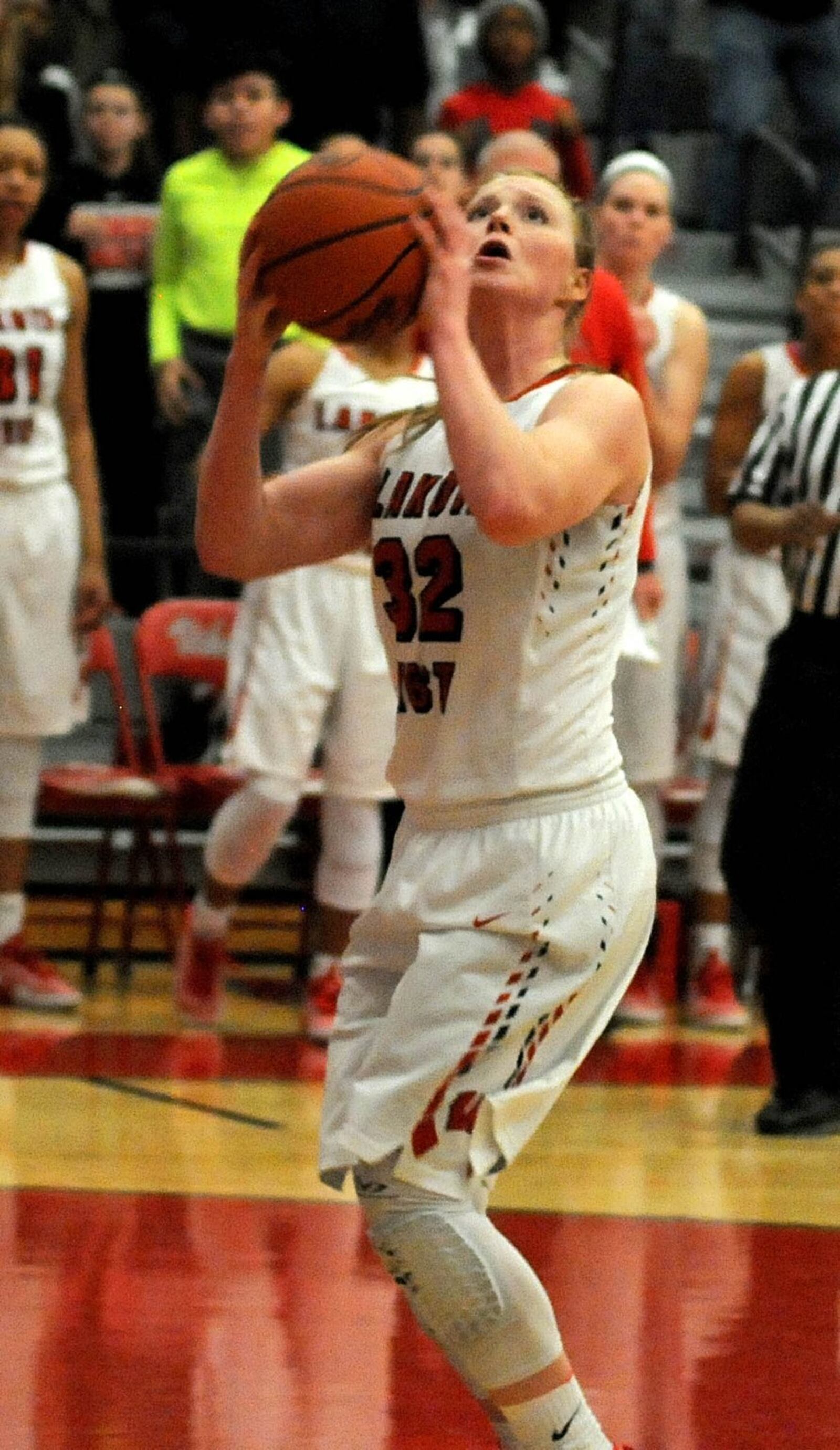 Lakota West’s Abby Prohaska (32) is about to connect on the go-ahead basket down the stretch in Saturday’s Division I district final against Beavercreek at Princeton. CONTRIBUTED PHOTO BY DAVID A. MOODIE