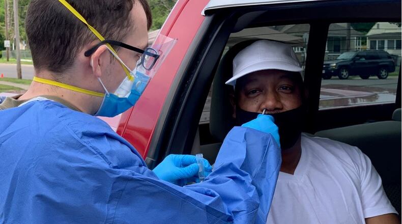 A medic from the Ohio National Guard administers a nasal swab test to Melvin Rakestraw of Middletown during a pop-up coronavirus COVID-19 testing center on Wednesday at the Robert “Sonny” Hill Community Center, 800 Lafayette Ave. More than 130 tests were conducted during a four-hour testing period. Results of the testing are expected back in 24-48 hours. ED RICHTER/STAFF