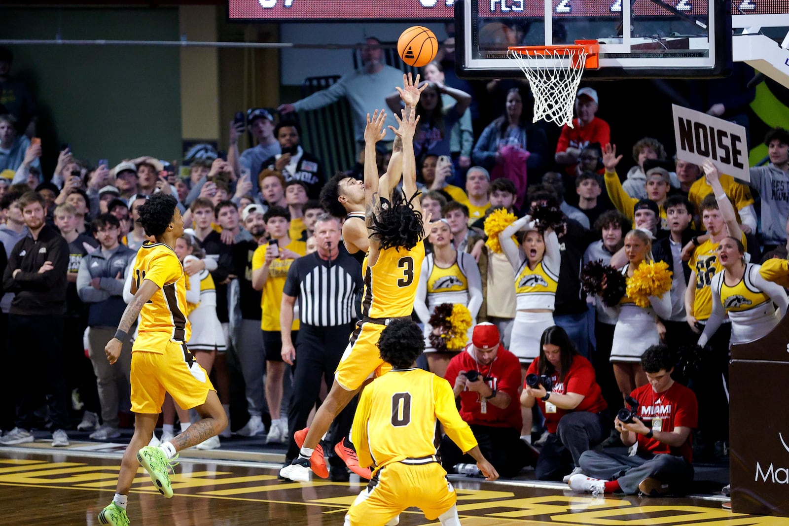 Miami (Ohio) guard Trey Perry, center rear, puts up the game-winning shot against Western Michigan guards EJ Ryans (3), Jayden Brewer, left, and Sharod Barnes (0) during the second half of an NCAA college basketball game, Friday, Feb. 27, 2026, in Kalamazoo, Mich. (AP Photo/Al Goldis)