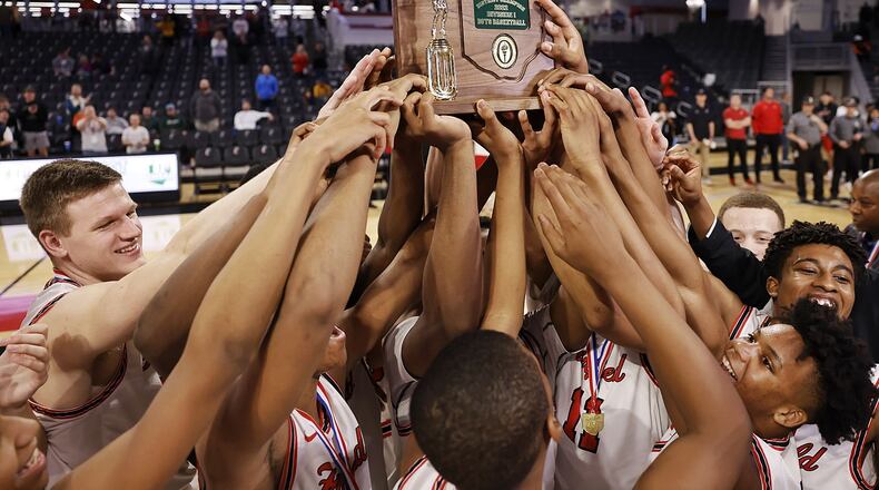 Fairfield celebrates with their trophy after their Division I District final basketball game against Walnut Hills Sunday, March 6, 2022 at Fifth Third Arena on the University of Cincinnati campus. Fairfield won 55-52. NICK GRAHAM/STAFF