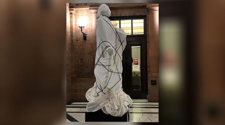 A statue of George Washington on Miami University’s campus was covered with a tarp as part of a class project about racism in the fall of 2020. CONTRIBUTED
