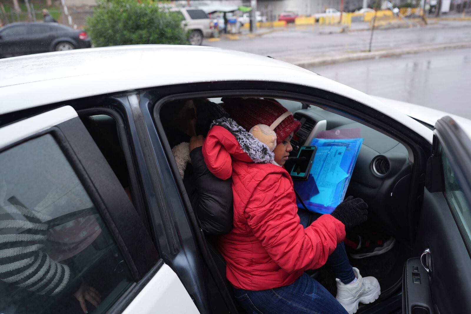FILE - Migrants seeking asylum in the United States load into a taxi after immigration officers turned them away from their scheduled meetings soon after President Donald Trump canceled the CBP One app, Jan. 20, 2025, in Matamoros, Mexico. (AP Photo/Eric Gay, File)
