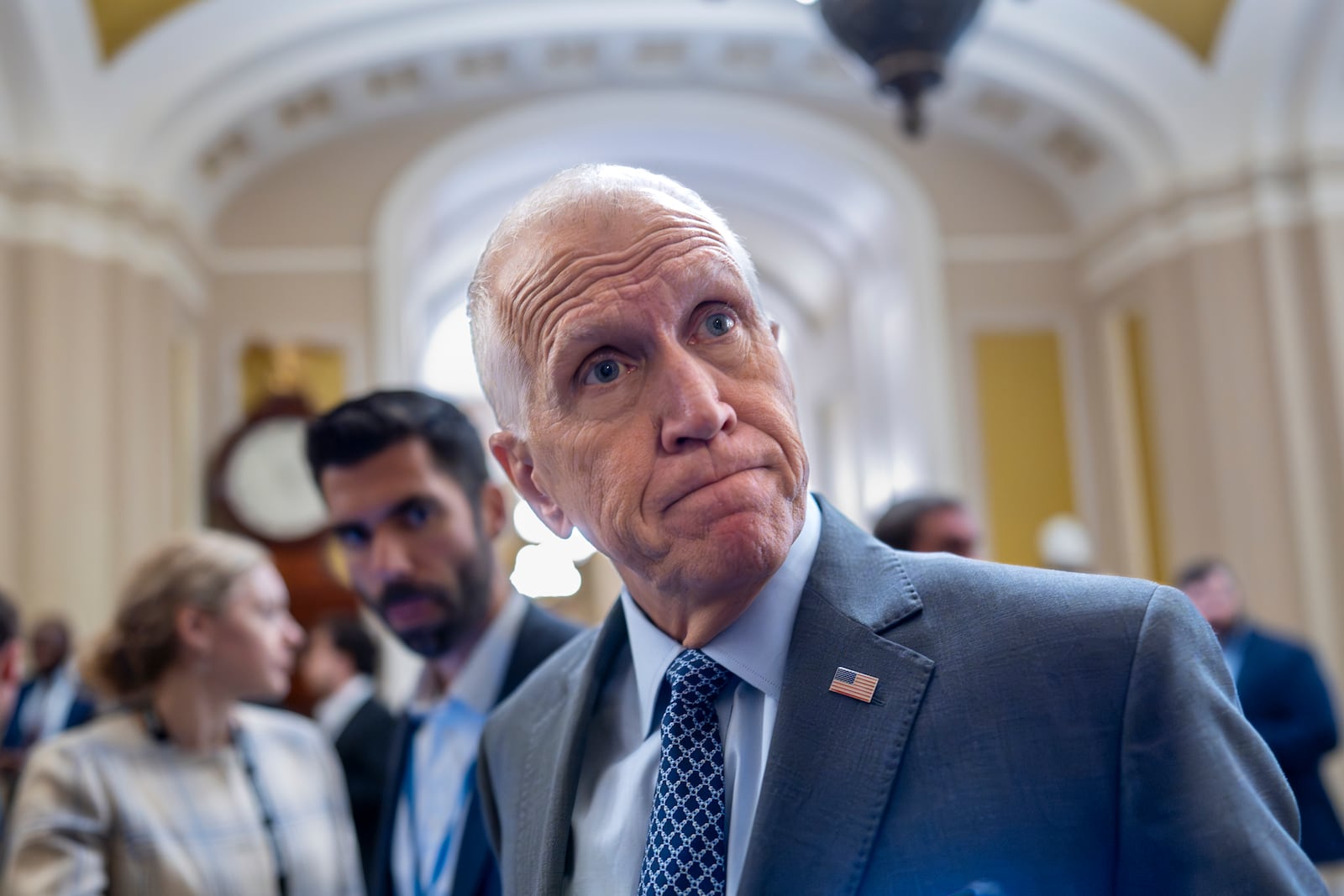 Sen. Thom Tillis, R-N.C., a member of the Senate Banking Committee, tells reporters that it would be a mistake for President Donald Trump to fire Federal Reserve Chair Jerome Powell, during a vote in the Senate, at the Capitol in Washington, Wednesday, July 16, 2025. (AP Photo/J. Scott Applewhite)