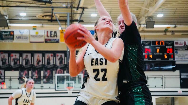 Lakota East’s Bella Sturgill (22) is defended by Mason’s Anneliese Knight on Wednesday. Chris Vogt/CONTRIBUTED