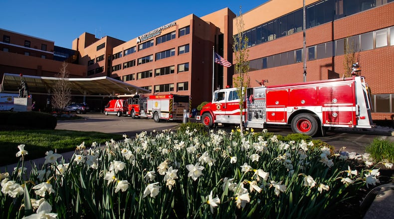 Police and Fire department vehicles from around Butler County lined up with emergency lights on to honor nurses, doctors and workers at Kettering Health Network's Fort Hamilton Hospital Tuesday evening, April 21, 2020 in Hamilton. The same thing happened at many hospitals in the area. NICK GRAHAM / STAFF