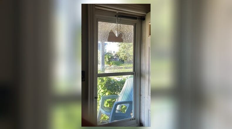 A Hamilton home shows where a bullet hit the front door. CONTRIBUTED