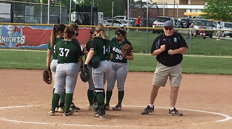 Badin coach Greg Stitzel comes out of a huddle with his team during a Division II district softball semifinal against Ross at Kings on May 15, 2018. Ross won 4-3 in 10 innings. RICK CASSANO/STAFF