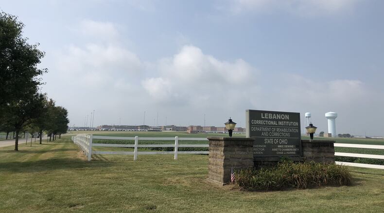 Praise Roberson, 28, of Cincinnati, is accused of working with an inmate at Lebanon Correctional Institution to smuggle drugs and cellphones into the institution. She faces seven charges, including drug trafficking and illegal conveyance into the prison.