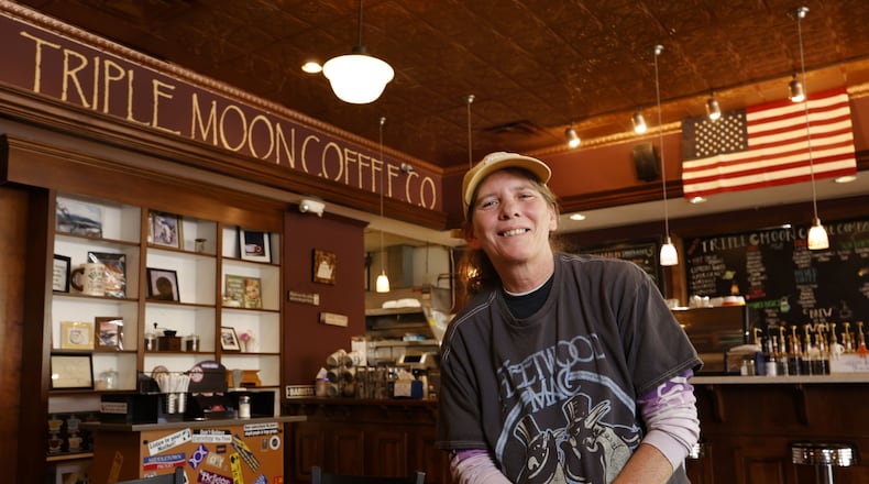 Heather Gibson, owner of Triple Moon Coffee, is celebrating 10 years in business on Central Avenue in downtown Middletown. NICK GRAHAM/STAFF