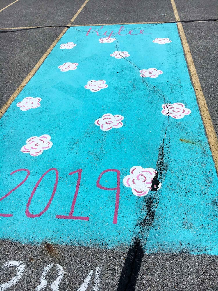 PHOTOS Lakota East seniors paint parking spots