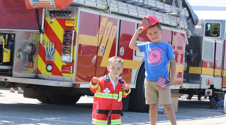 Children and their families enjoy a previous Touch-A-Truck event where attendees got an opportunity to see and learn more about official vehicles and to meet police, fire and community services personnel. CONTRIBUTED