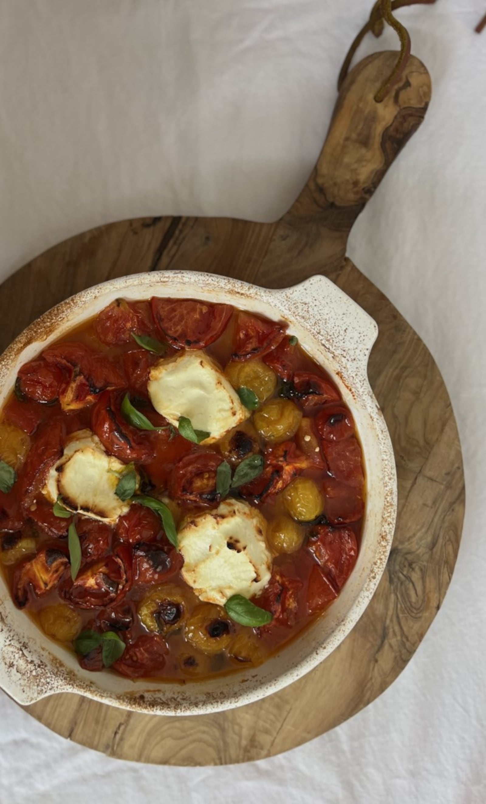 This recipe of cherry tomatoes, garlic cloves, goat cheese and more can be a time saver for people who haven't had time to fully cook something. WHITNEY KLING/CONTRIBUTED