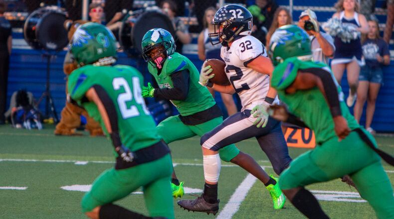 Edgewood's Braden Sullivan runs through the Chaminade Julienne defense on his way to a 53-yard touchdown in the opening minutes of Friday's game. CONTRIBUTED/Jeff Gilbert