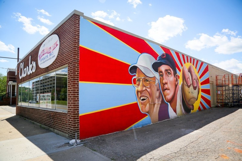 The new Hamilton mural featuring Cincinnati Reds legend, Joe Nuxhall, painted on the side of Clark’s Sporting Goods on Hamilton s west side. GREG LYNCH / STAFF Staff Writer