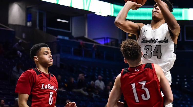 Lakota East's Nate Johnson puts up a shot Wednesday, March 11, 2020 in their Division I Regional boys basketball semifinal against La Salle at Xavier University's Cintas Center.  NICK GRAHAM / STAFF