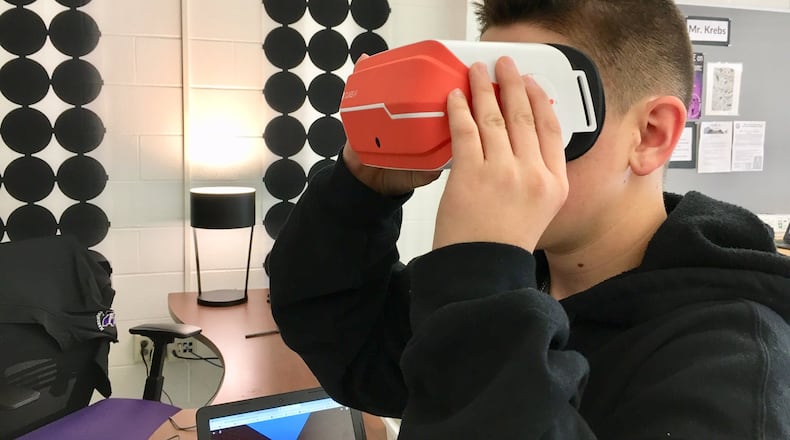 A new virtual reality art program has students at Middletown High School learning computer coding and creating their own computer animated works of art. Students then can immerse themselves in their own art work via virtual reality goggles (pictured). (Photo By Michael D. Clark/Journal-News)